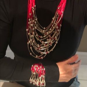 BNWT red satin and silver multi strand necklace with matching bracelet.